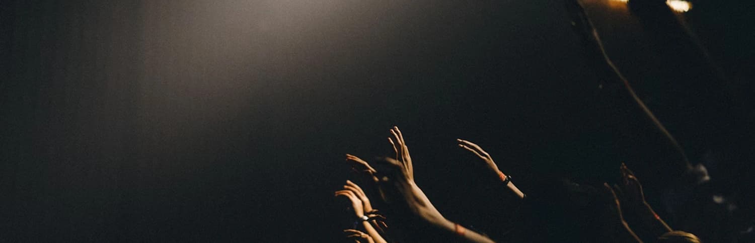 Worship service with raised hands